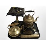 A 19th-century cast-iron and brass trivet, brass kettle on burner stand, a further kettle,