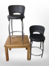 A contemporary oak veneered square lamp table,