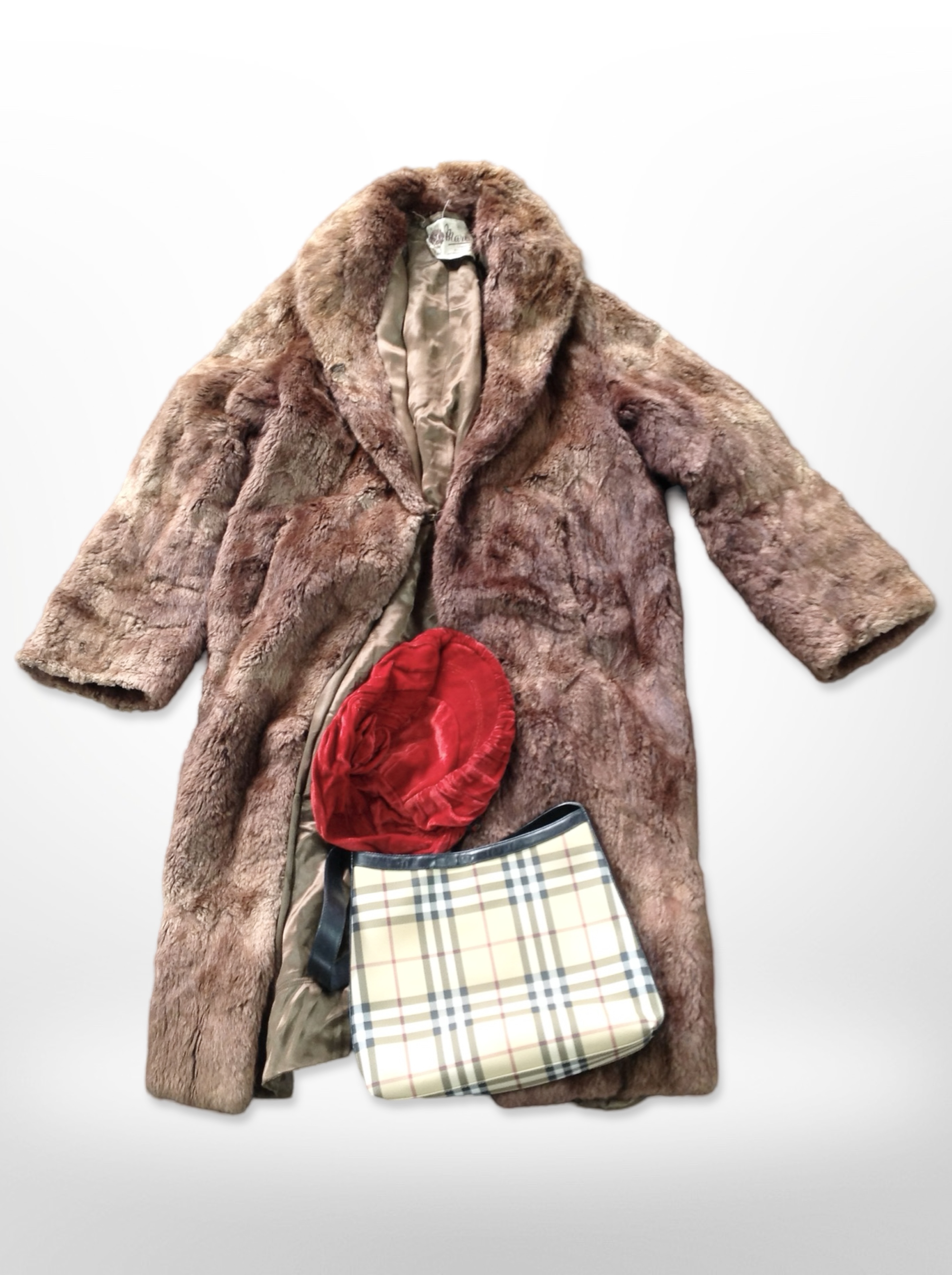 A lady's three quarter length mink fur coat by Marcus together with Burberry shoulder bag