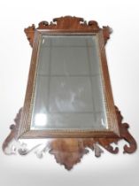 A George III-style mahogany wall mirror, height 72cm.