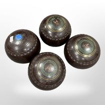 Four Henselite lawn bowls