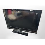 A Sony Bravia 32-inch LCD TV with lead and remote.