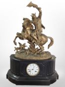 A large antique black slate and gilt metal figural mantel clock depicting a king on horseback,