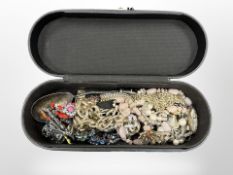 A large jewellery box containing costume jewellery,