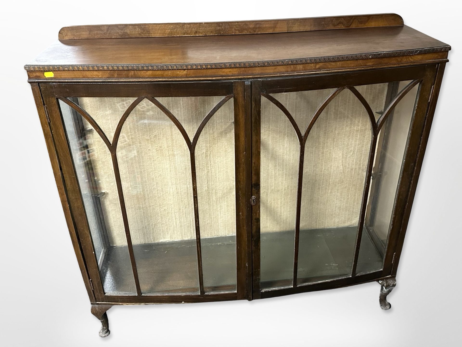A walnut bow fronted display cabinet,