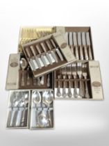 A group of boxed stainless steel and EPNS cutlery sets.