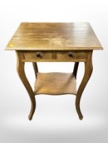 An oak two tier occasional table, width 52 cm,