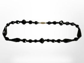 An antique Whitby jet necklace, length 40 cm.