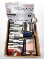 A Sony Playstation 1 console in box, together with various Playstation 2, Xbox and Nintendo games.