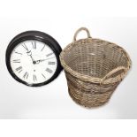 A large contemporary quartz wall clock, diameter 48cm, together with a wicker laundry basket.