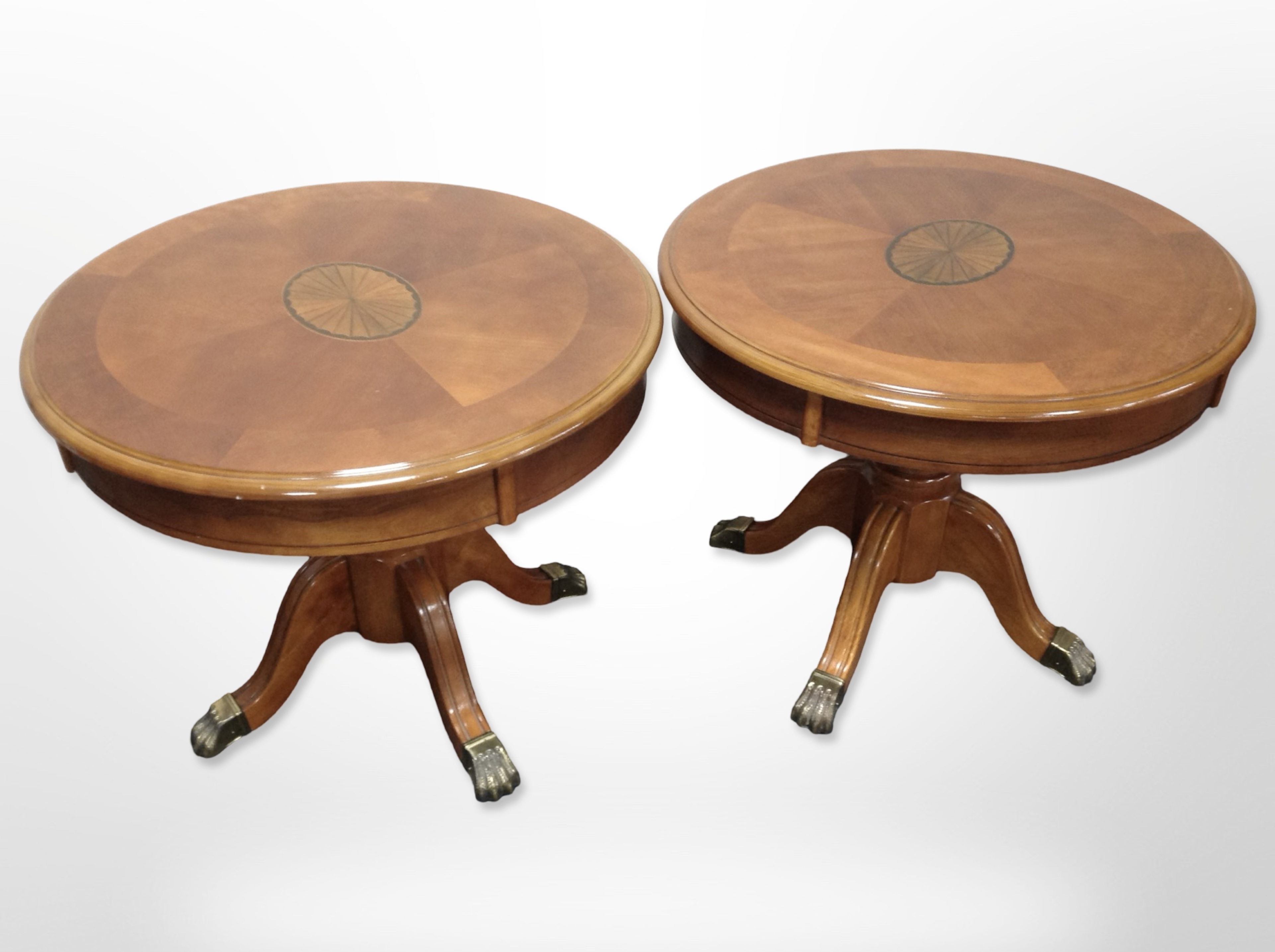 A pair of reproduction yew wood circular occasional tables,
