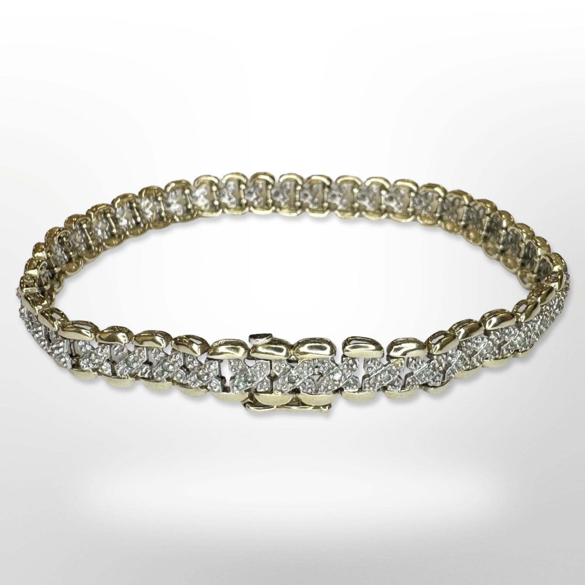 A 9ct yellow gold bracelet set with diamonds, length 19 cm. CONDITION REPORT: 9.6g.