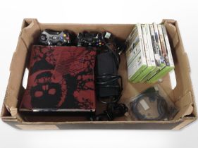 An Xbox 360 console, controllers, games.