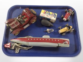 A group of Schuco wind up toys including mouse in box, tin plate submarine,