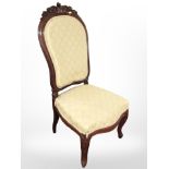 A carved mahogany salon chair on cabriole legs