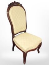 A carved mahogany salon chair on cabriole legs