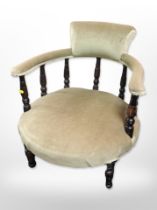 An early 20th century low salon armchair in olive dralon fabric
