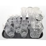 A crystal decanter and assorted drinking glasses.