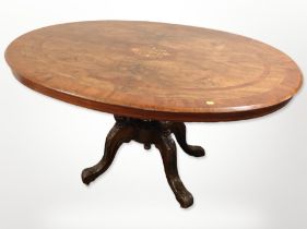 A Victorian walnut and satinwood inlaid oval breakfast table,