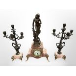 A French spelter and rouge marble three-piece clock garniture, height 59cm.