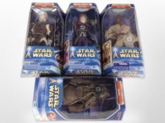 Four Hasbro Star Wars: Attack of the Clones and the Empire Strikes Back figurines, boxed.