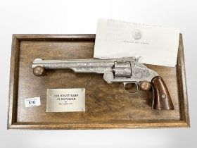 A Franklin Mint replica Wyatt Earp revolver on stand