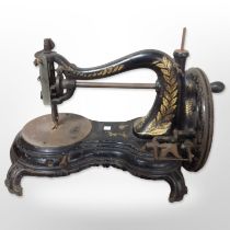 A 19th century cast iron hand sewing machine