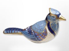 A Royal Crown Derby bird paperweight with gold stopper.