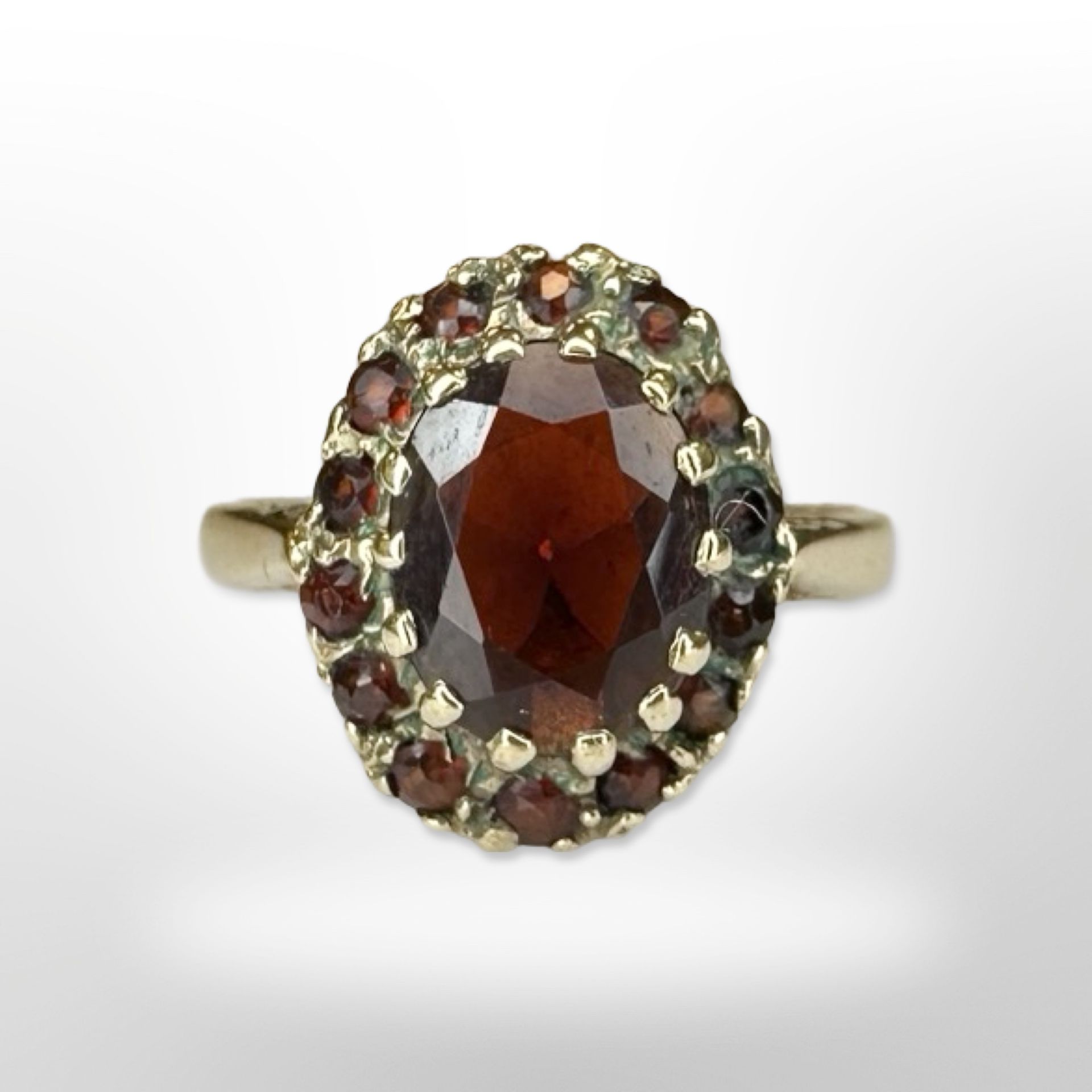 A 9ct yellow gold garnet cluster ring, size N. CONDITION REPORT: 3.5g.
