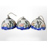 A set of three Tiffany style pendant light shades,