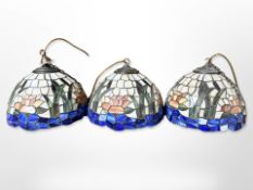 A set of three Tiffany style pendant light shades,