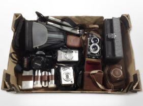 A group of vintage cameras including Franke and Heidecke Rolleicord twin lens camera,