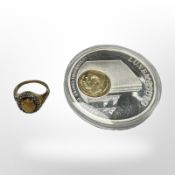 A silver gilt dress ring with opalescent stone, together with a Luxembourg commemorative coin.