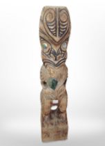 A carved totem pole figure, height 34cm.