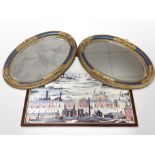 A pair of ornate gilt and gesso oval bevelled mirrors, 54cm x 37cm,
