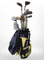 A Prosimmon golf bag containing assorted irons and drivers including Ben Sayers Spalding