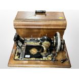 An antique Jones sewing machine in box