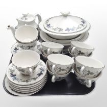 Approximately 27 pieces of Royal Doulton Burgundy tea and dinner porcelain.