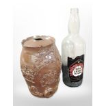 A stone ware keg, height 34cm, together with a large glass Blackheart rum bottle.