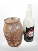 A stone ware keg, height 34cm, together with a large glass Blackheart rum bottle.