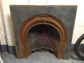 A late Victorian cast iron fire insert,