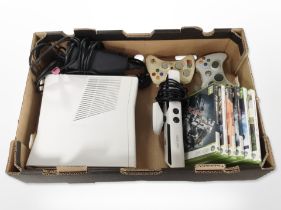 An Xbox 360 console, controllers, games.