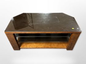 A contemporary glass topped tv stand,