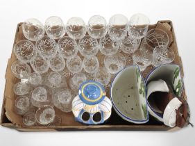A quantity of crystal drinking glasses, two pottery wall pockets, etc.