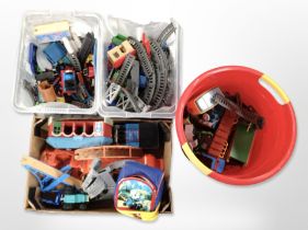 A collection of Thomas the Tank Engine toys.