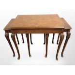 A figured walnut nest of three tables,