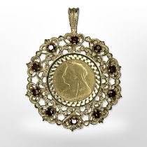 An 1894 22ct gold half sovereign coin mounted in 9ct yellow gold set with garnets as a pendant.