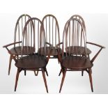 A pair of Ercol stained elm armchairs and three similar single chairs