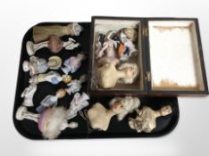 A Victorian inlaid walnut jewellery box containing a group of porcelain half dolls and other dolls.