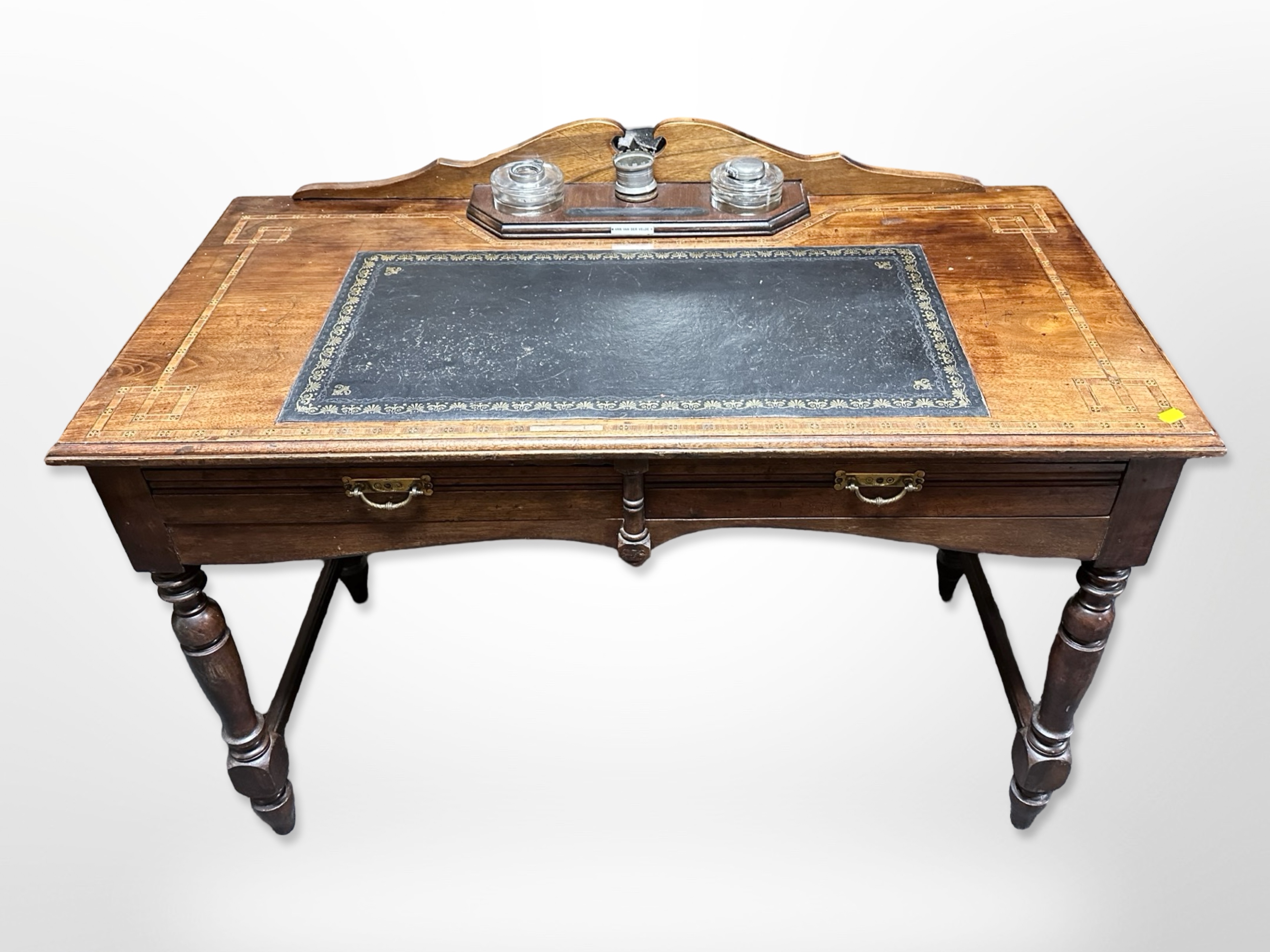 A Victorian mahogany and parquetry inlaid leather topped writing desk,